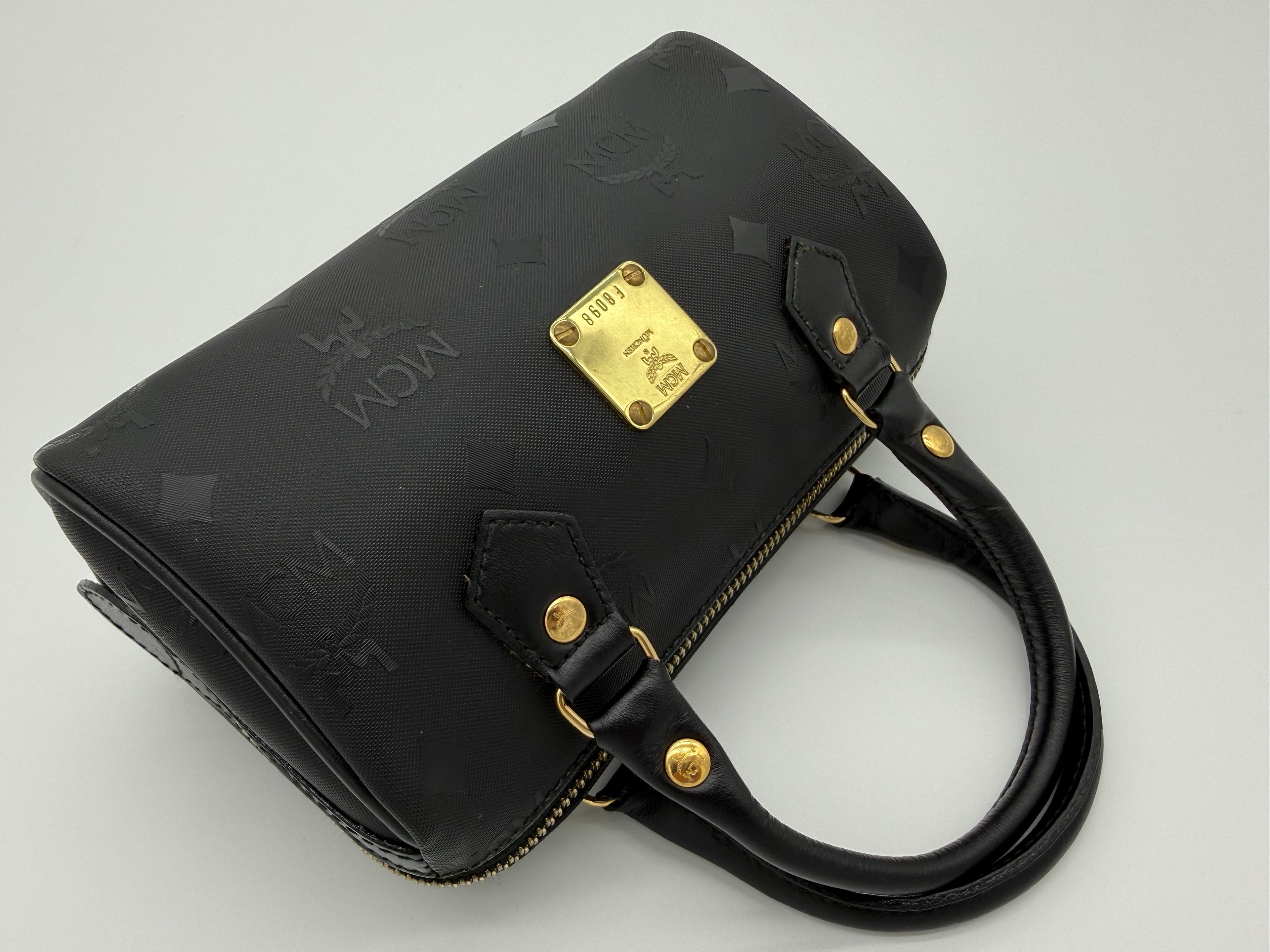 MCM Visetos Logogram 2-Way Hand Bag – Black PVC Leather with Gold Hardware (SKU: gh828)
